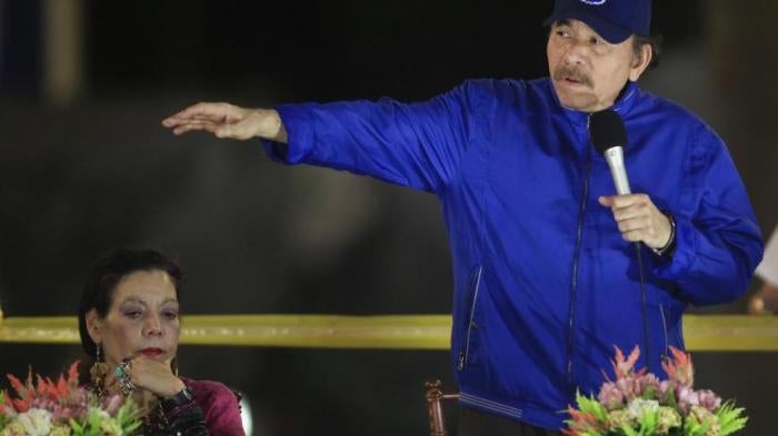 Nicaragua's President Daniel Ortega speaks next to first lady and Vice President Rosario Murillo during the inauguration ceremony for a highway overpass in Managua, Nicaragua, Thursday, March 21, 2019.