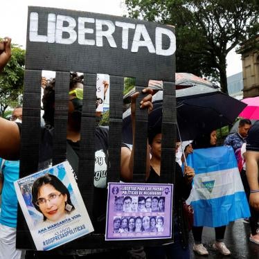 A demonstrator with a banner calling for the freedom of political prisoners in Nicaragua takes part of a march of Nicaraguans exiled in Costa Rica, in San Jose, Costa Rica, November 6, 2022.