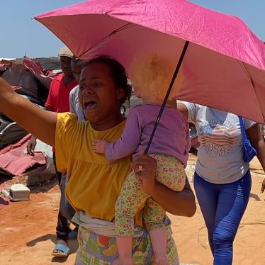 angola woman baby crying woman outside