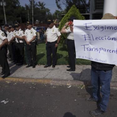 Supporters of the Liberation of the People (MLP) political party protest that the Supreme Electoral Tribunal denied the candidacy of their vice president hopeful Jordan Rodas in Guatemala City, Thursday, Feb. 16, 2023. The sign reads in Spanish "We demand transparent elections." The Electoral Tribunal has barred two candidates from running for president in the elections set for June 2023.