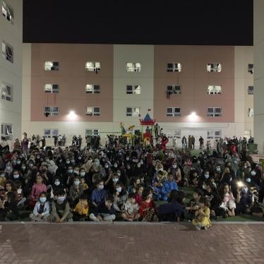 Afghans rally in an Afghan refugee camp in Abu Dhabi, the capital of the United Arab Emirates, to protest their non-transfer to the United States, February 13, 2022.