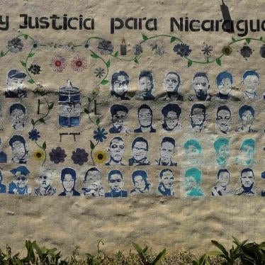 A mural showing images of Nicaraguans killed during the 2018 social security reform protests under the words “memory and justice for Nicaragua”  adorns a wall at the Nicaragua Nunca Más human rights organization in San Jose, Costa Rica, February 20, 2023.