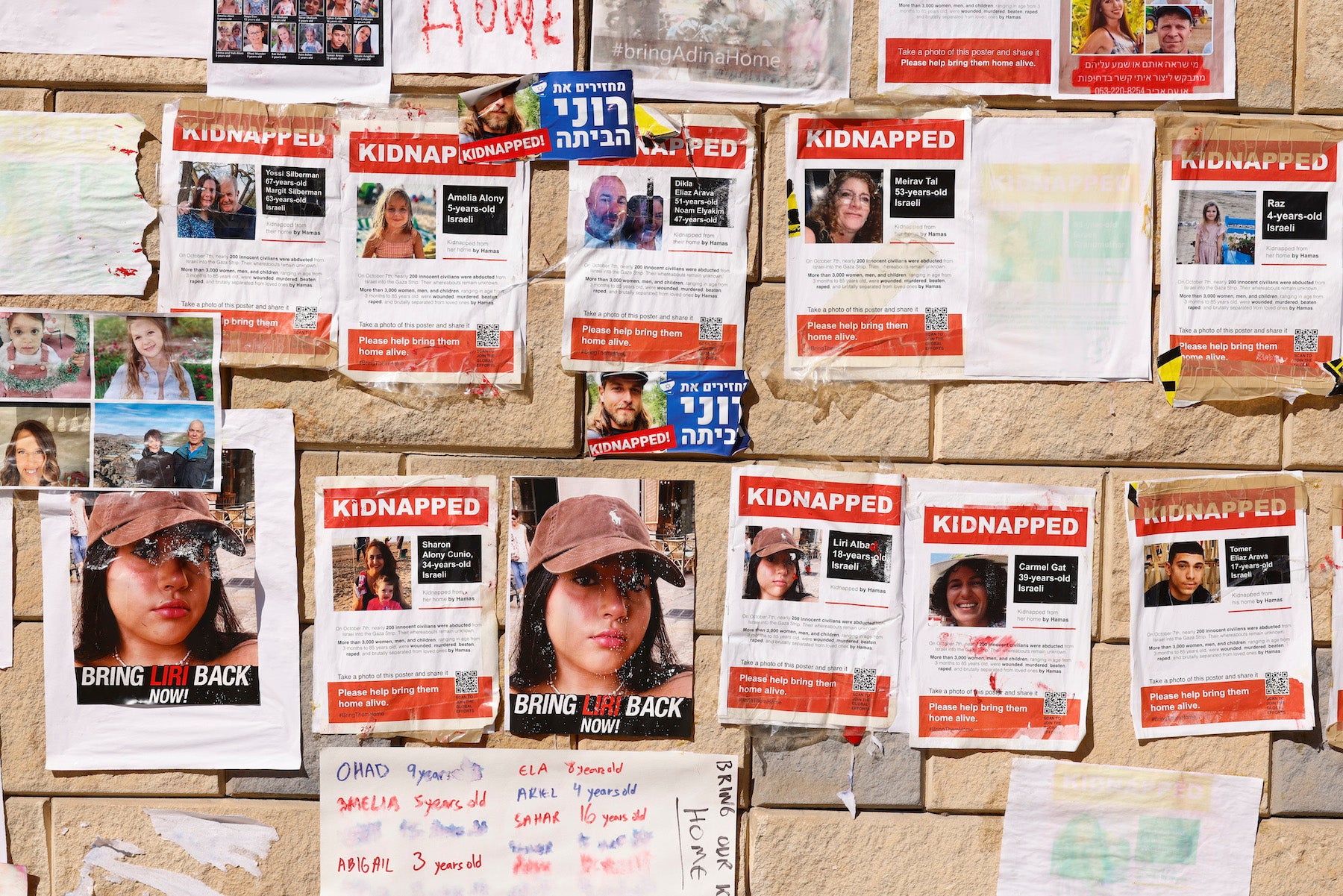 Photographs of Israelis taken as hostages during an October 7 attack by Hamas-led fighters, at a protest demanding their release, outside the HaKirya military base in Tel Aviv, Israel, on October 17, 2023. 