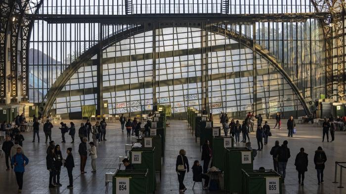 People vote at the former Mapocho train station, now a cultural center, during an election to choose members of a council to draft a proposed new constitution, Santiago, Chile, May 7, 2023. 