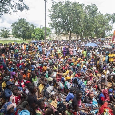 Displaced people from the province of Cabo Delgado gather to received humanitarian aid from the World Food Program in Namapa, Mozambique, February 27, 2024. 