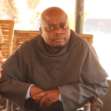 Portrait of a seated priest 