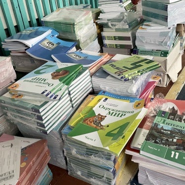 Copies of textbooks arranged on a table