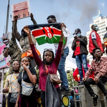 A protester holds a Kenyan flag during the nationwide demonstration against proposed legislation that would increase taxes across the country's economy, June 25, 2024. 