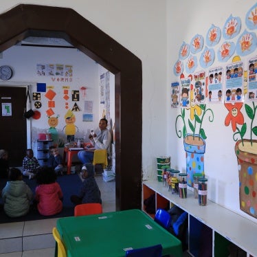 A teacher gives lessons to children at an early learning center in De Aar Town, South Africa, August 11, 2023.