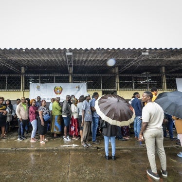 People wait to cast their votes at a polling station for the general elections, Maputo, Mozambique, October 9, 2024. 