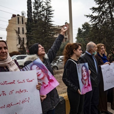 Syrian Kurds demonstrate outside a UN building, calling on WHICH??authorities to help obtain the release of girls abducted and recruited into fighting, in the northeast city of Qamishli, November 28, 2021.