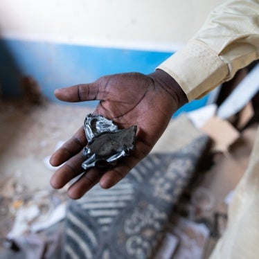 A resident of the Ridina district in N'Djamena shows the fragments of a projectile, that fell into a house on May 9, 2024, in N'Djamena following the announcement of the provisional results of the Chad presidential elections.