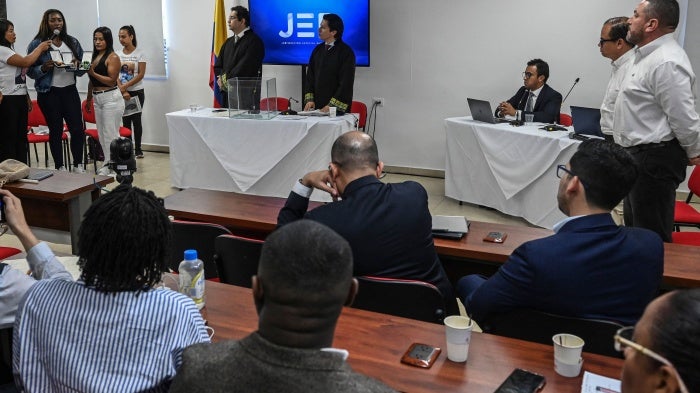 Relatives of victims of extrajudicial executions and magistrates are pictured during a hearing of the Special Jurisdiction for Peace (JEP) in Cali, Colombia on June 5, 2023.