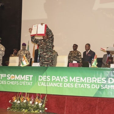 The leaders of Niger, Gen. Abdourahamane Tiani (C), Mali, Col. Assimi Goita (L), and Burkina Faso, Capt. Ibrahim Traore (R), show the documents of the Confederation of Sahel States, which they signed during their first summit in Niamey, Niger, July 6, 2024.