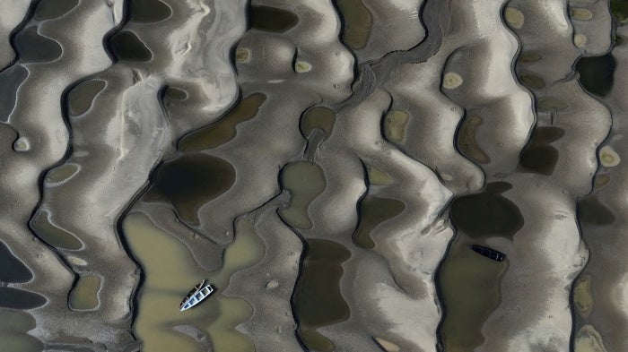 Boats stranded over exposed sandbanksdue to drought at the Solimoes River, one of the largest tributaries of the Amazon River, during the most intense and widespread drought Brazil has experienced since records began in 1950