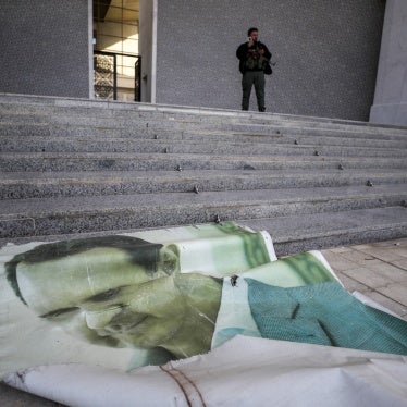 Photo of Bashar al-Assad lies on the floor of the presidential palace in Damascus