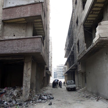 Human Rights Watch researchers visit the site of the mass grave in Tadamon, Damascus on December 11, 2024. Human Rights Watch confirmed the mass grave’s exact location after verifying a leaked video, taken in April 2013, showing summary executions by Syrian government forces and affiliated militia. 