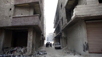 Human Rights Watch researchers visit the site of the mass grave in Tadamon, Damascus on December 11, 2024. Human Rights Watch confirmed the mass grave’s exact location after verifying a leaked video, taken in April 2013, showing summary executions by Syrian government forces and affiliated militia. 