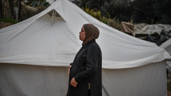 A Palestinian woman pregnant with triplets, suffers from malnutrition and extreme anemia due to food shortages, at a displaced persons camp in Rafah, Gaza, February 14, 2024. 