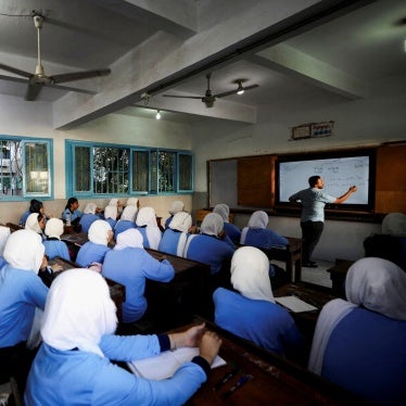 An Egyptian teacher instructs students on the first day of the academic year at Orman school, in Cairo, Egypt, September 22, 2024. 