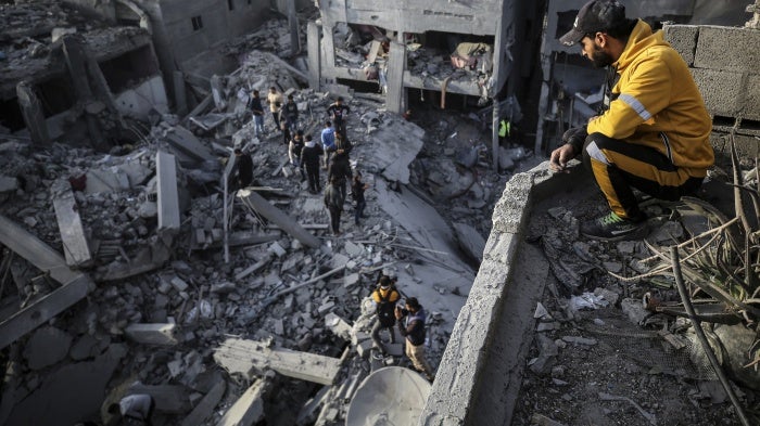 Palestinians inspect the damage after an Israeli strike on the Nuseirat refugee camp in the central Gaza Strip on December 7, 2024.