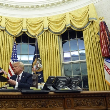 US President Donald Trump signs executive orders in the Oval Office of the White House in Washington DC, January 20, 2025. 