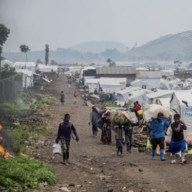 People leaving an IDP camp near Goma.