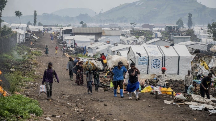 People leaving an IDP camp near Goma.