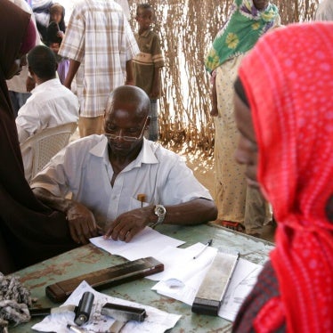 A woman has her fingerprints taken as she registers with the United Nations High Commissioner for Refugees (UNHCR) at the Liboi transit point in Kenya, near the Somali border, November 1, 2006.