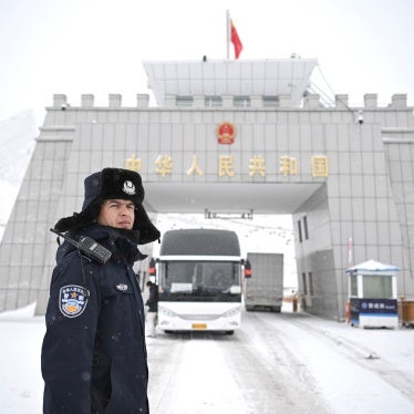 A Chinese police officer on a snowy road.