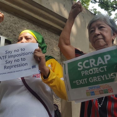 Protesters outside the Department of Justice denounce the filing of terrorist financing cases against activists and demand that the Marcos administration stop using the FATF's "grey list" to target civil society, Manila, Philippines, January 22, 2025.