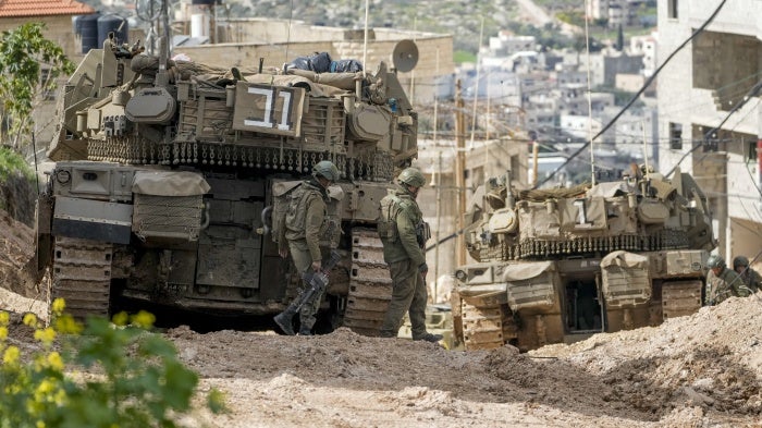 Israeli tanks are deployed during an ongoing army operation in the Jenin refugee camp in the occupied West Bank, February 24, 2025.