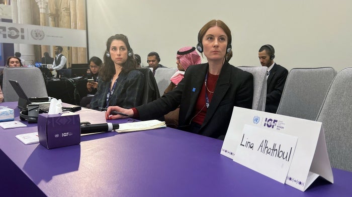 A sign stands in front an empty seat for Saudi human rights activist Lina al-Hathloul, during the Internet Governance Forum in Riyadh, on December 18, 2024. 