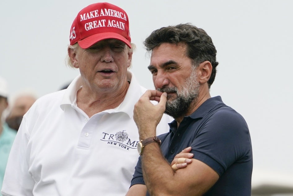 US President Donald Trump, left, talks with Yasir Al-Rumayyan, governor of Saudi Arabia's Public Investment Fund, during the Bedminster Invitational LIV Golf tournament in Bedminster, New Jersey, July 29, 2022. 