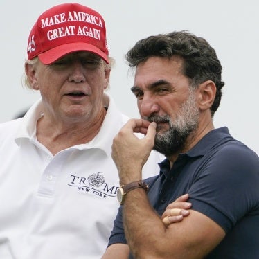 US President Donald Trump, left, talks with Yasir Al-Rumayyan, governor of Saudi Arabia's Public Investment Fund, during the Bedminster Invitational LIV Golf tournament in Bedminster, New Jersey, July 29, 2022. 