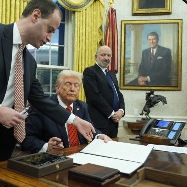 President Donald Trump signs an executive order in the Oval Office at the White House, Washington, DC, February 10, 2025.