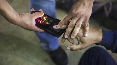 A NeoScan 45 fingerprint scanner, paired with an app known as EDDIE, is used by ICE to run remote ID checks. 