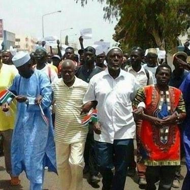 Protesters march in Banjul on April 16, 2016 following the death in custody of opposition activist Solo Sandeng.