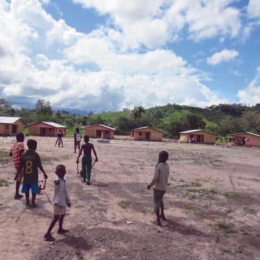 Children play in one of the new villages created on arid plots of land to house families who were relocated to make room for the African Minerals Limited iron ore mine near the town of Bumbuna, Sierra Leone.